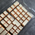 Custard yellow PBT double-shot keycaps. Durable, opaque PBT and warm dual-tone cream aesthetic displayed from multiple angles.