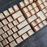 Custard Yellow PBT Double-Shot Keycaps, many angles. Highlights durable PBT, warm dual-tone, and crisp double-shot legends.