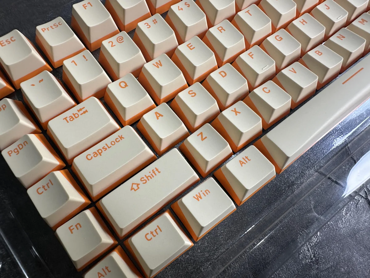 Gallery of durable Custard Yellow PBT double-shot keycaps keyboards, featuring their warm, opaque dual-tone cream aesthetic from variant angles.