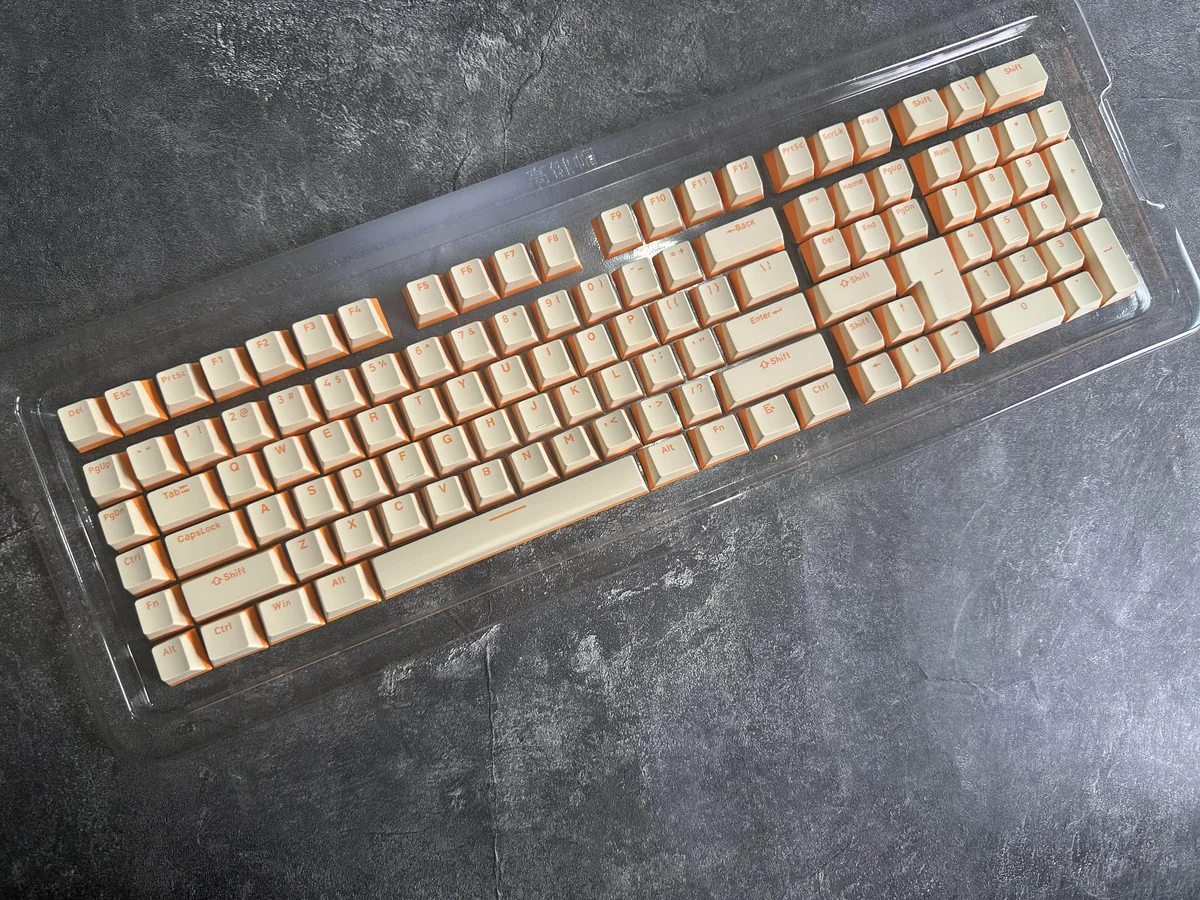 Main image featuring premium custard yellow PBT double-shot keycaps, highlighting their durable build and warm dual-tone aesthetic with crisp.