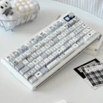 Multiple views of Sweet Checker PBT side-lit keycaps, revealing the charming plaid pattern, crisp top legends, and unique side illumination.