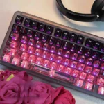 Gallery of PC gradient keycaps in black-pink, showcasing their high-transparency PC material and sleek design from multiple angles.