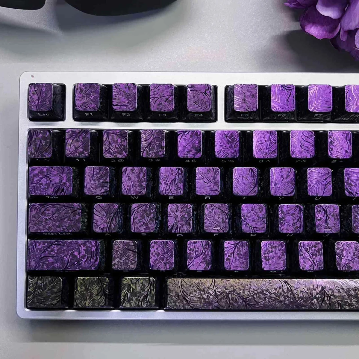 Elegant Peacock Keycap Set showcasing intricate iridescent feather patterns and side-engraved legends from a different angle, highlighting artistic design.