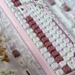 Pink Mood MOA Keycaps gallery, revealing soft pastel pink hues and smooth retro spherical profile from artistic angles, enhancing a cheerful typing experience.