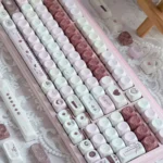 Charming Pink Mood MOA Keycaps, highlighting soft pastel pink hues and smooth retro spherical profile. An artistic angle for cheerful typing.