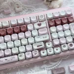 Charming Pink Mood MOA keycap set showcasing soft pastel pink hues and smooth retro spherical profiles from various artistic angles.