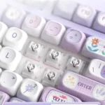 Close-up of the Dreamy PBT Purple Mist MOA Keycap Set, revealing its ethereal purple gradients and tranquil design from a distinct, premium angle.