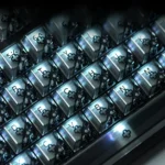 Gallery view of Quantum Hive Lite Keycaps, highlighting their translucent PC, futuristic geometric design, and vibrant full RGB illumination from variant angles.