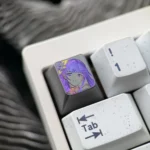 Artistic close-up of the hand-carved Raiden Shogun titanium artisan keycap, revealing its intricate design, matte finish, and powerful elegance.