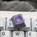 Hand-carved Raiden Shogun titanium artisan keycap from a unique angle, highlighting intricate lines and matte finish.