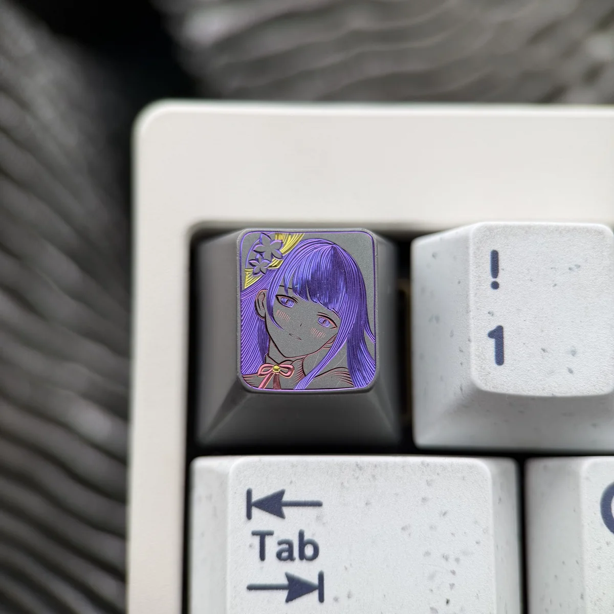 Experience the artistry of this hand-carved Raiden Shogun titanium artisan keycap, featuring intricate lines and a powerful matte finish.