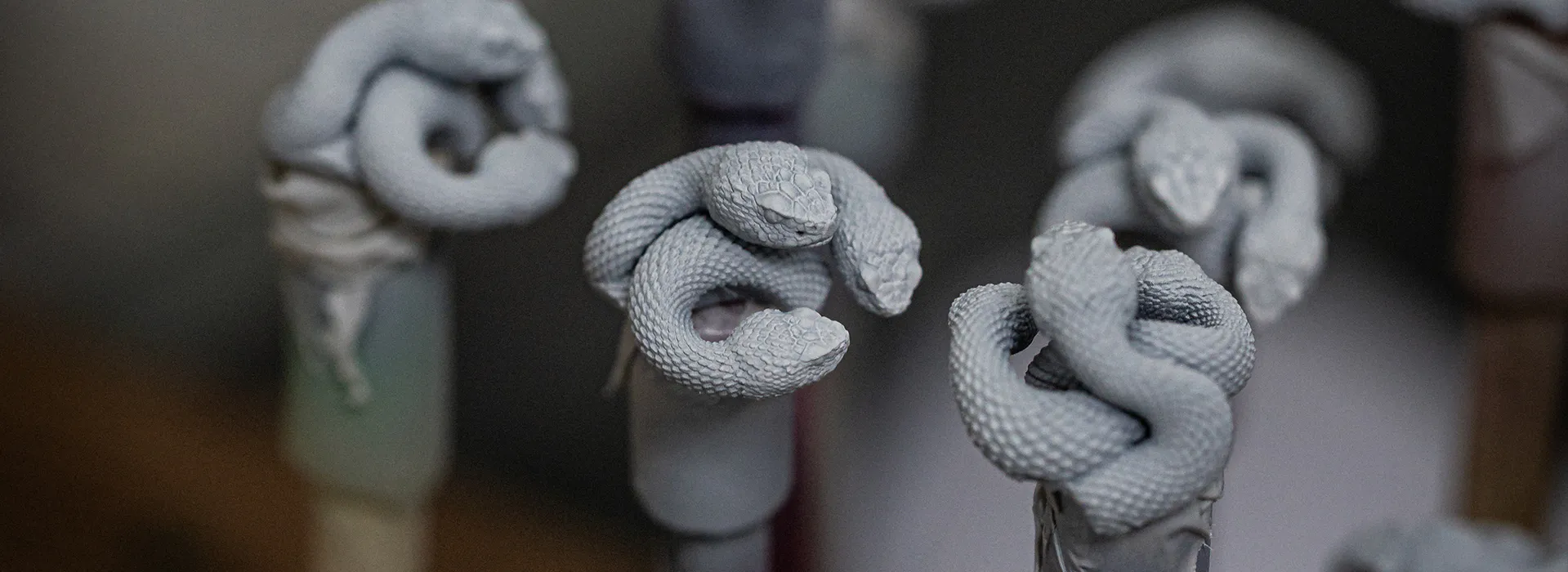 Unpainted Razer Triple-Headed Snake sculpts during the 3D modeling stage