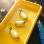 Chubby Banana Hand-painted Resin Artisan Keycap. Unique handcrafted resin banana design, vibrant, whimsical details. A cheerful desktop accent.