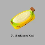 Vibrant 1.75U resin artisan keycap showcasing a unique, hand-painted chubby banana character, a cheerful and whimsical desktop accent.