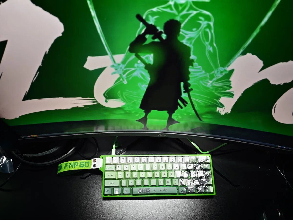 Explore the exclusive Zoro Keycap Set from various angles, highlighting its One Piece PBT Dye-Sub design, iconic samurai motifs, and vibrant green accent.