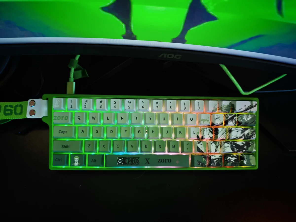 Exclusive Zoro Keycap Set: premium PBT dye-sub keycaps. Multiple angles highlight iconic One Piece Zoro art, samurai motifs, and vibrant green accent.