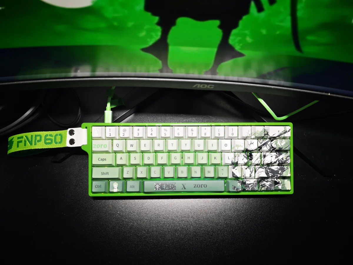 Exclusive Zoro Keycap Set. Premium PBT dye-sub keycaps featuring iconic One Piece Zoro imagery, samurai motifs, and vibrant green accents.
