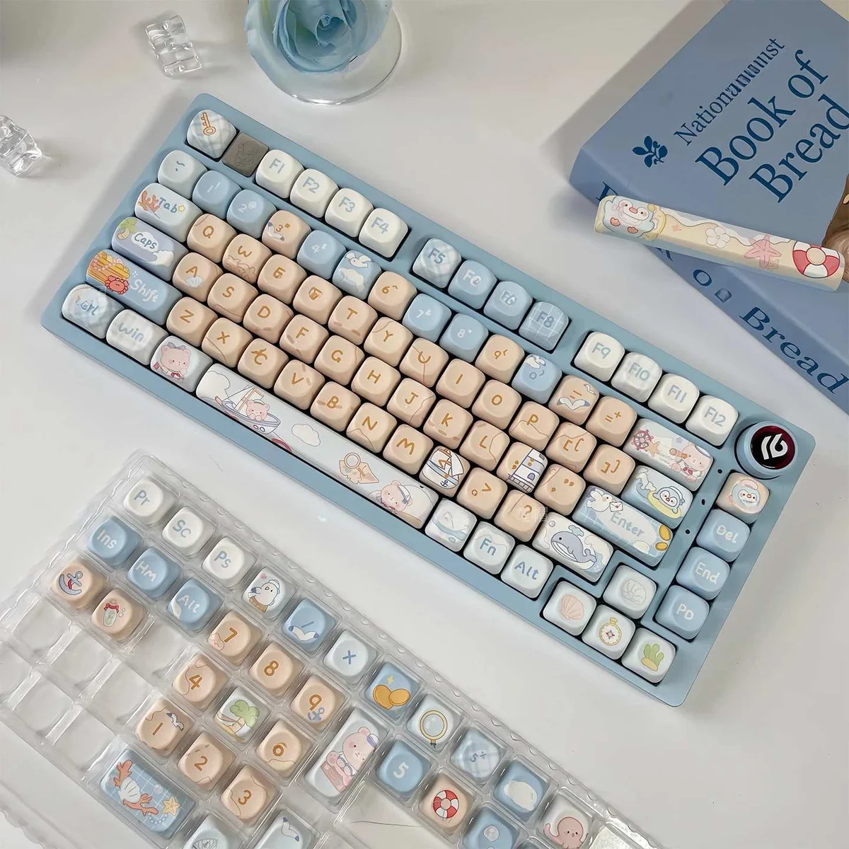 Charming Sailor Bear MOA Keycap Set, shown from a playful angle. Whimsical design with a cute bear, ocean hues, and maritime elements for a fun desk.