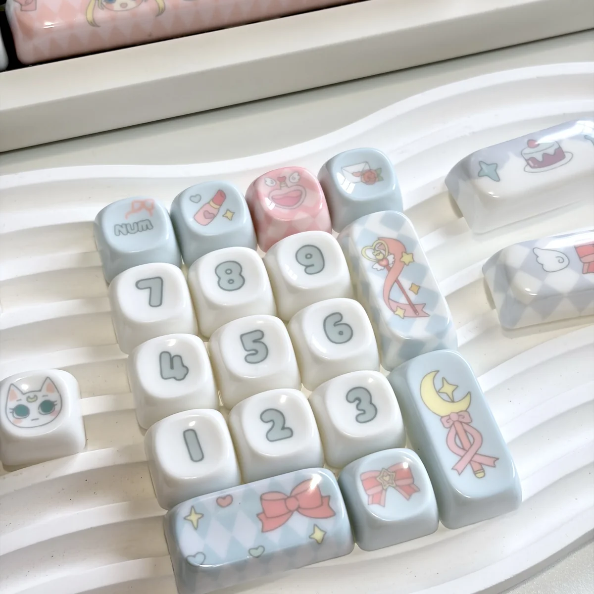 Sailor Moon Jade MOA Keycaps from various angles, showcasing their enchanting pastel magical girl design and smooth, premium jade resin.