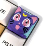 Handcrafted 3D resin Sailor Moon Luna keycap, showcasing its whimsical anime character design and artistic details. A unique custom piece.