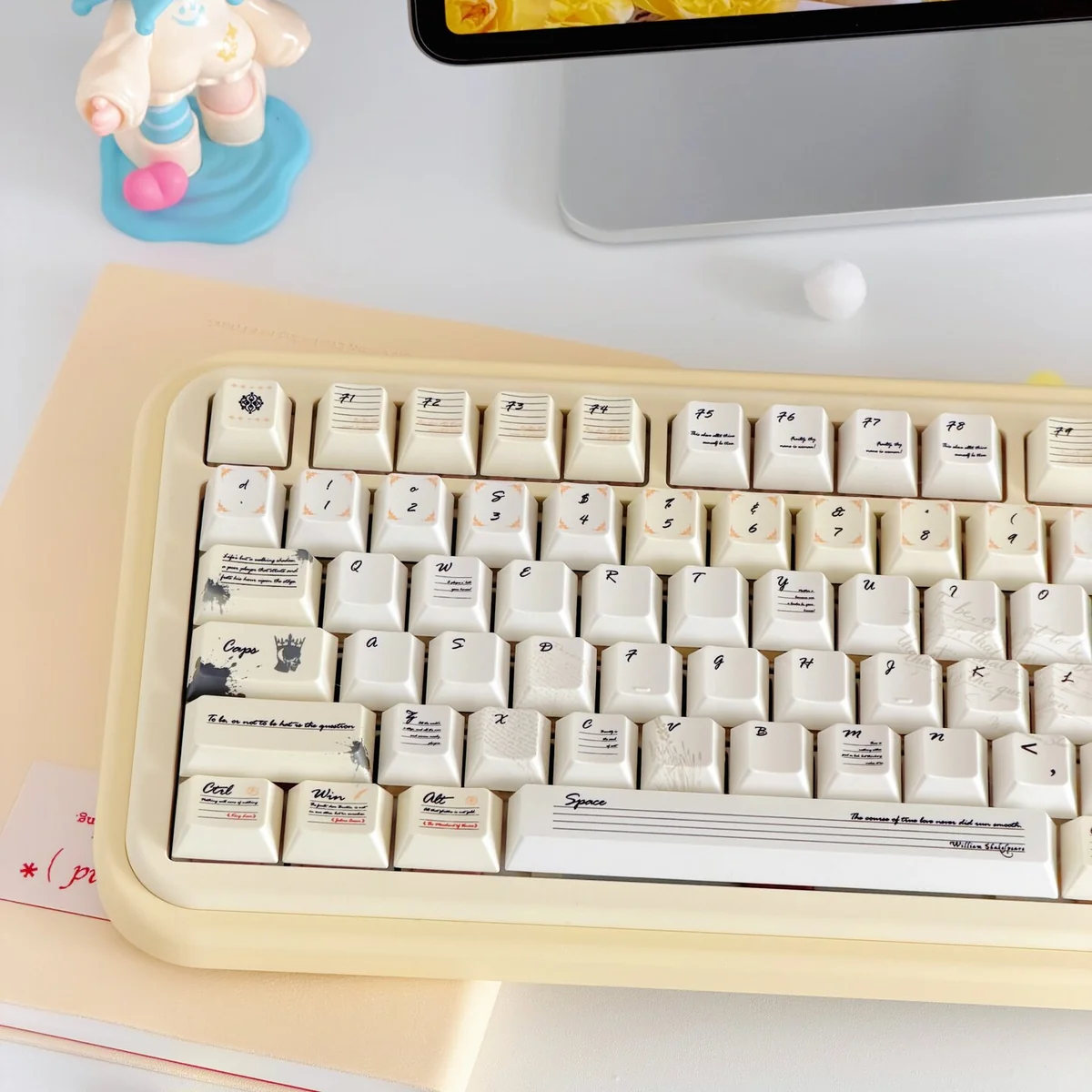 Shakespeare PBT Keycaps Set gallery. Vintage milky yellow, shimmering pearlescent finish, literary accents.
