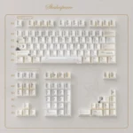 Shakespeare Keycaps Set: Premium vintage milky yellow PBT keycaps with a shimmering pearlescent finish, exuding literary elegance.