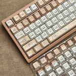 Close-up of unique Siamese Cat Azukisan PBT keycaps Set in various profile, showcasing earthy tones and playful cat motifs for a cozy, artistic keyboard.