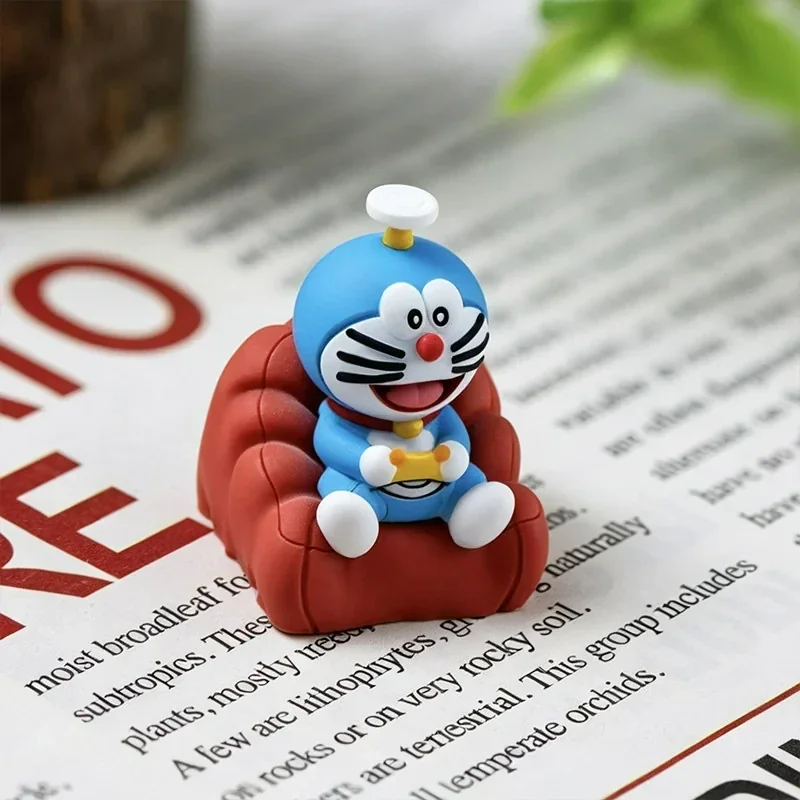 A close-up view of the handcrafted Doraemon resin ESC keycap, highlighting its whimsical design and vibrant blue and white details for nostalgic fun.