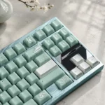 Song Matte Translucent ABS Cherry keycaps, matte semi-transparent profile, displayed from various angles, highlighting the subtle diffused light and premium finish.