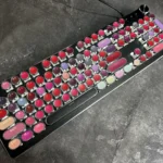 Main display of the Daring Lipstick Steampunk Mechanical Keyboard, showcasing its vibrant, glossy, retro-futuristic design with bold lipstick.