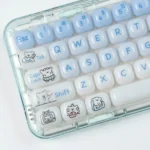 A whimsical Animal Spa: Swimming Maltese Dog MOG Keycap Set, viewed from a delightful angle, highlights its vibrant translucent design and adorable cartoon dog.