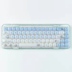 A playful, vibrant Animal Spa: Swimming Maltese Dog MOG Keycap Set featuring an adorable translucent cartoon dog relaxing in a clear pool.