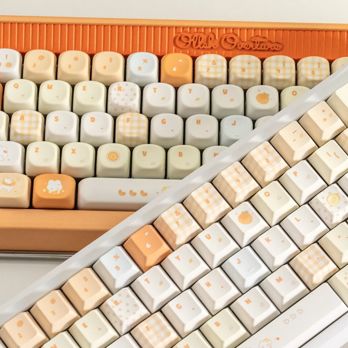 Vibrant Tangelo Mochi PBT dye-sub keycaps, shown from various playful angles, highlighting the unique dessert-inspired design in orange and cream.