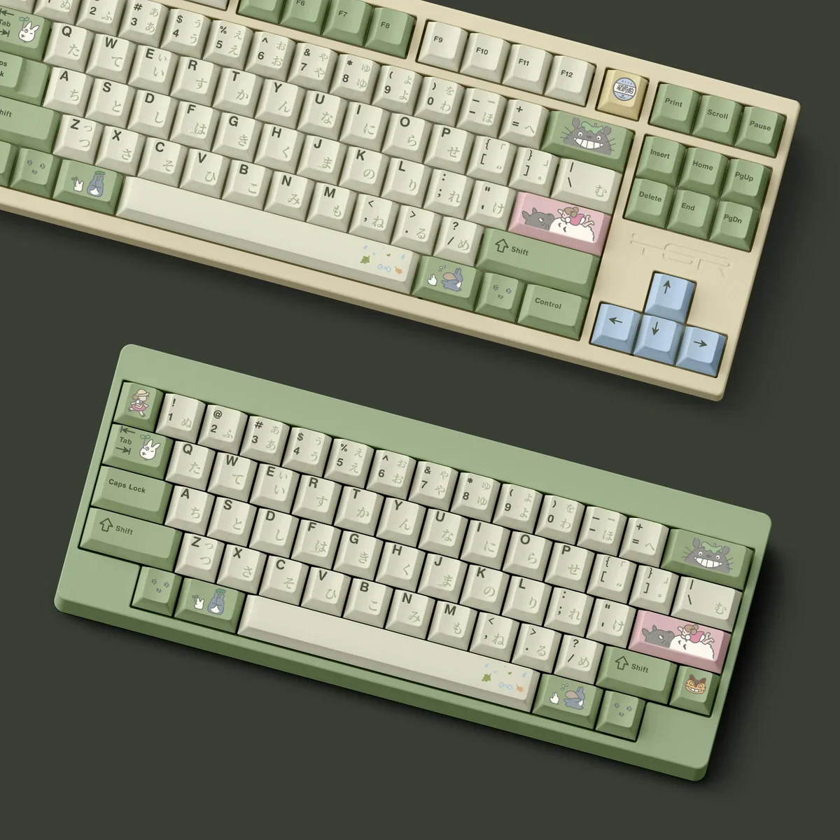 Whimsical Totoro PBT Dye-Sub keycaps showcasing iconic forest spirits in a soothing palette, perfect for a nostalgic desk setup.