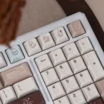 A delightful angle of the Joyful Cocoa Duck themed mechanical keyboard, showcasing its warm hues, tri-mode connectivity, and silent linear switches.
