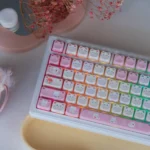 UR98 Spring Kitten Tri-Mode Mechanical Keyboard from various angles, showcasing pastel keycaps, ergonomic white base, tri-mode silent linear switches, and playful typing experience.