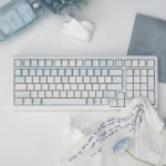 UR98 Winter Letter Tri-mode Mechanical Keyboard, showcasing its elegant white winter design, silent linear switches, and versatile connectivity.