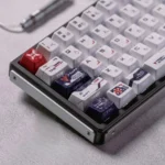 A collection of Ultraman Tiga GUTS PBT keycaps from various angles, showcasing the exclusive side-printed backlit design and tactical carbon fiber.