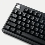 WOB Pure Black PBT Cherry keycaps, classic black and white, shown from various angles highlighting durable legends and refined aesthetic.