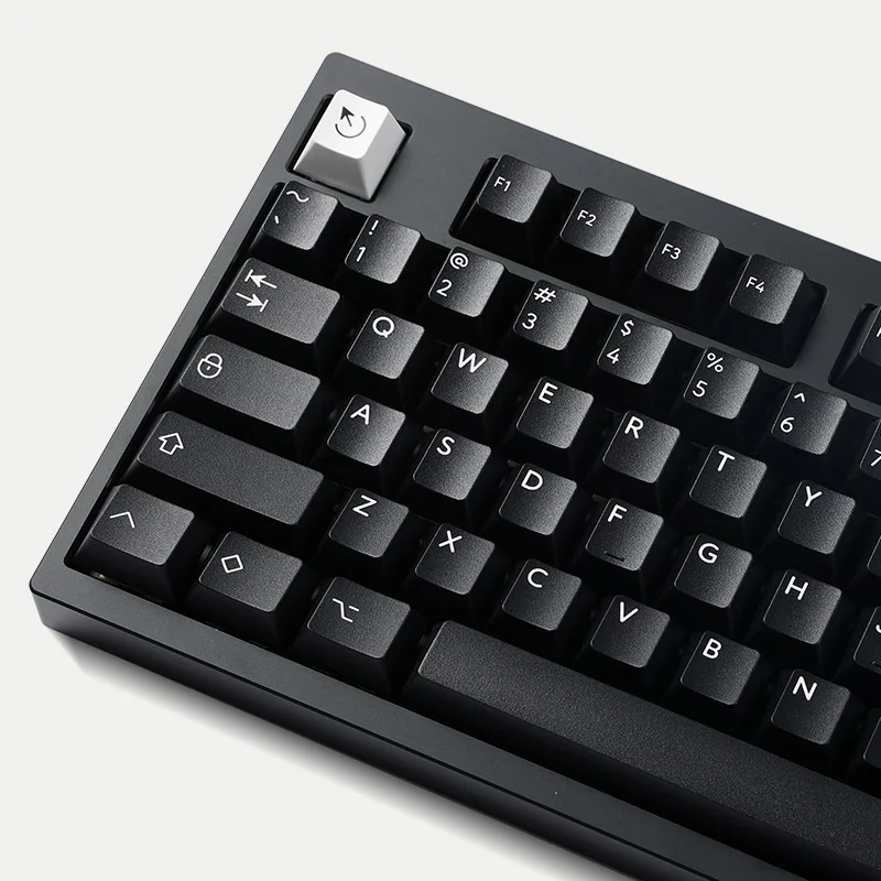 WOB Pure Black PBT Cherry keycaps, classic black and white, shown from various angles highlighting durable legends and refined aesthetic.