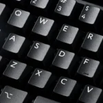 WOB Pure Black PBT Cherry keycaps showcasing their classic black and white aesthetic, highlighting durable PBT material and crisp legends.
