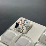 Close-up of a handcrafted Celestial Zircon Hexagram Luxury Metal Keycap, showcasing its sparkling multi-faceted zircon and gleaming metallic accents.