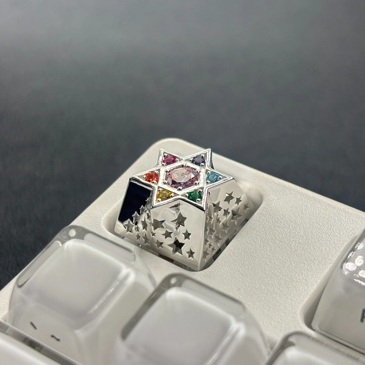 Close-up of a handcrafted Celestial Zircon Hexagram Luxury Metal Keycap, showcasing its sparkling multi-faceted zircon and gleaming metallic accents.