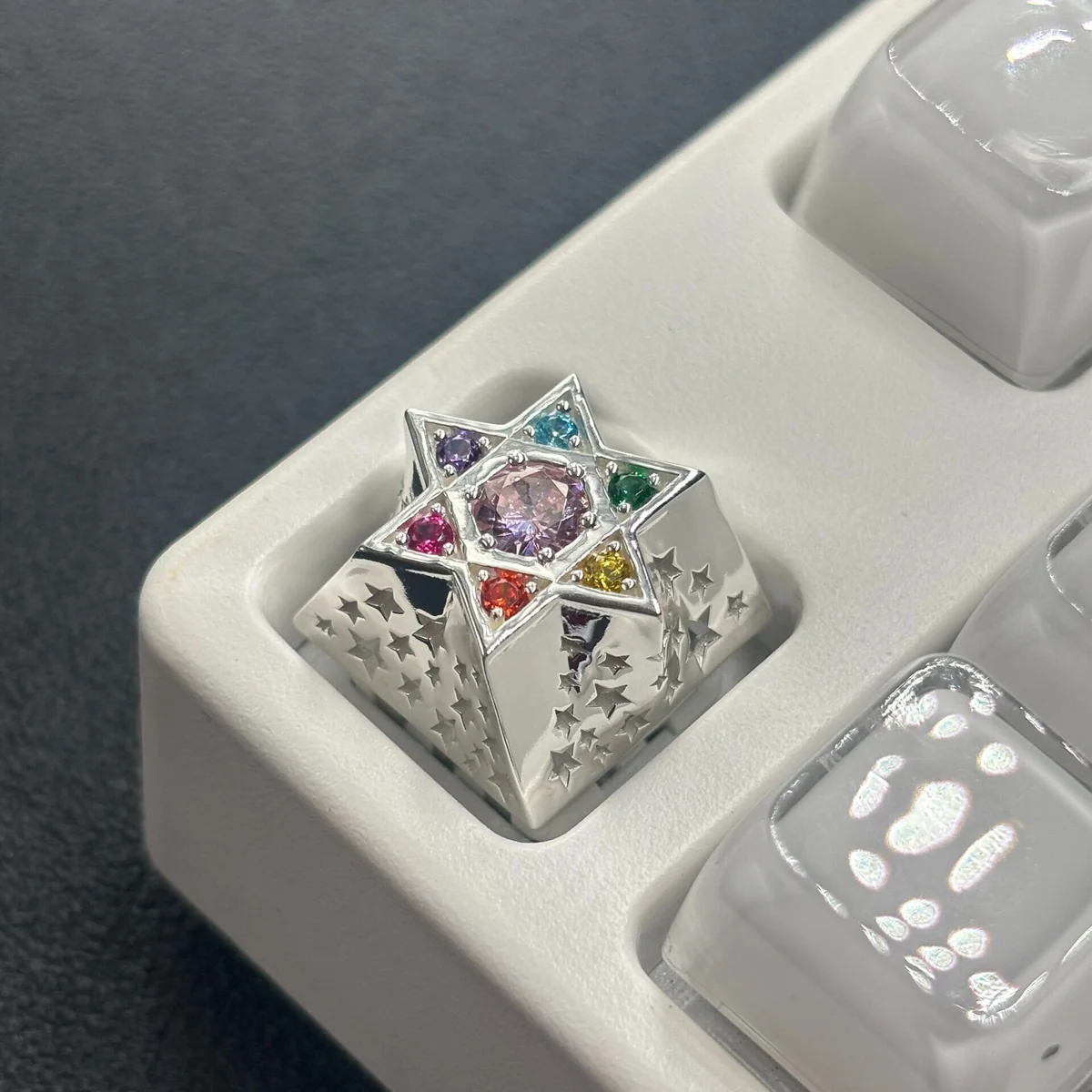 Handcrafted Zircon hexagram luxury metal keycap, showcasing its sparkling multi-faceted zircon gem and gleaming metallic hexagram.