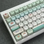 Adorable, vibrant green zoo MOA PBT accent keycap with charming, rounded animal characters. Whimsical design for a playful keyboard.