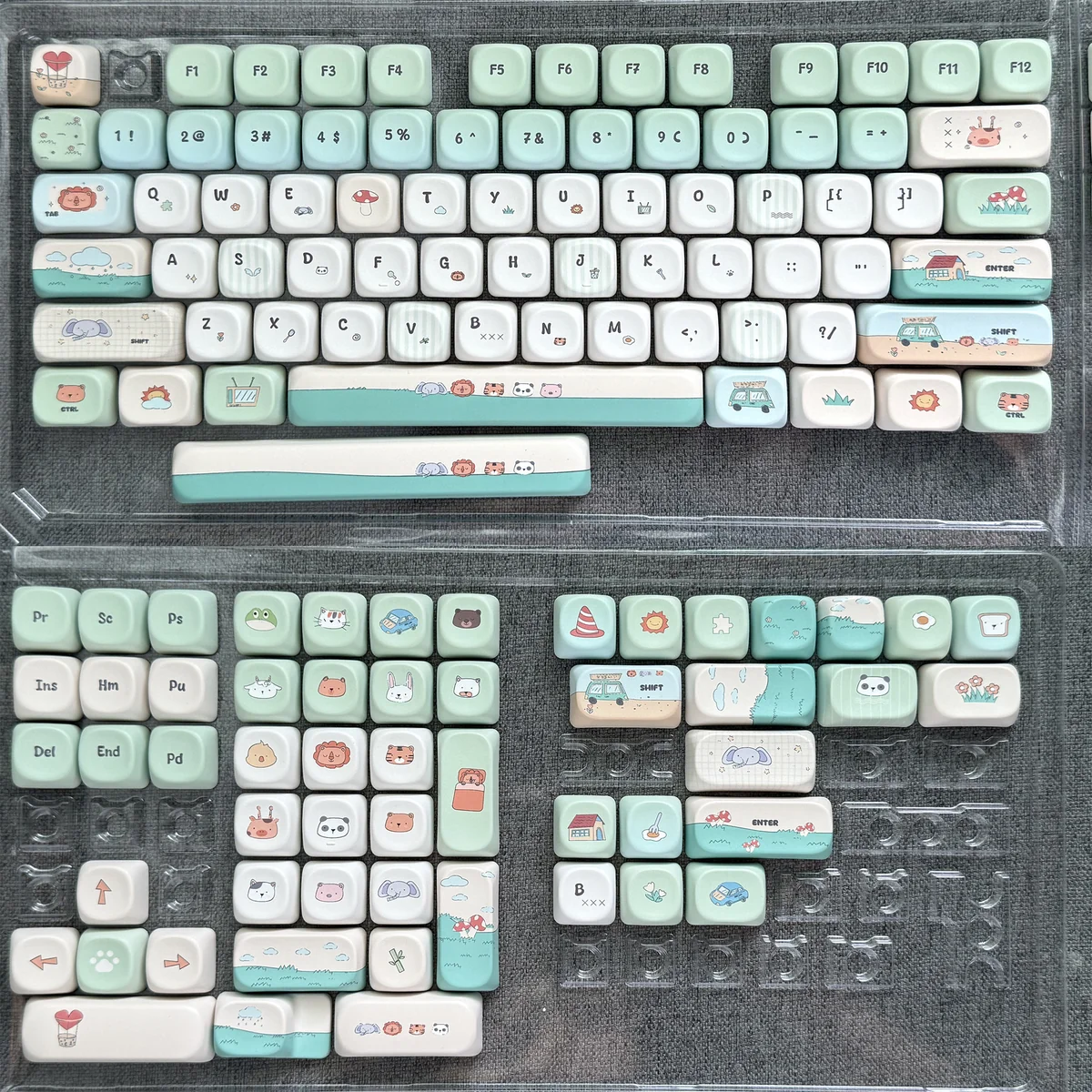 Whimsical Zoo MOA keycap main display, showcasing an adorable green PBT animal accent with charming rounded characters for a playful keyboard.