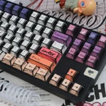 Graffiti keycaps hand-drawn PBT keycap set mounted on a keyboard, showing bold color blocking and playful street art icons.