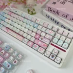 Adorable Pet MOA keycap set displayed from various angles, highlighting vibrant PBT dye-sub keycaps with charming cartoon pet illustrations.