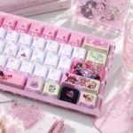 Angels of Delusion Cherry Keycap Set with pastel chibi angel art and PBT side-lit legends glowing on a kawaii white and pink mechanical keyboard.