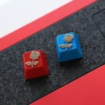 Close-up views of the limited edition zinc alloy rose artisan metal keycap, showcasing its intricate design and mysterious sea fog finish from various angles.